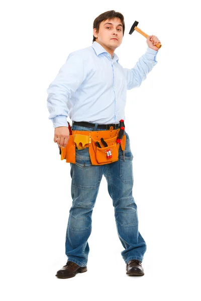Construction worker brandishing hammer — Stockfoto