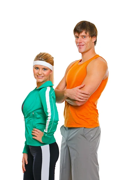 Dziewczynka fitness i człowiek w sportowych na białym tle nosić — Zdjęcie stockowe