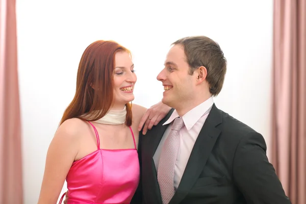 Portraits of formally dressed smiling couple — Stock Photo, Image