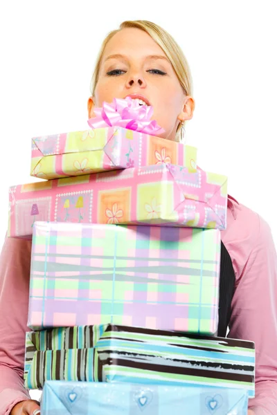 Woman looking out from stack of present boxes — Stock Photo, Image
