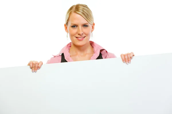 Happy woman showing blank billboard — Stock Photo, Image