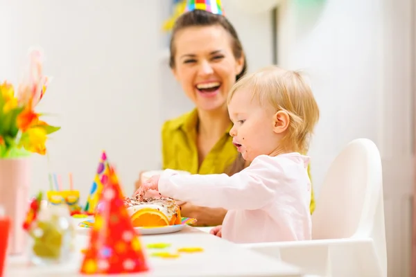 Baby celebrating first birthday with mother — Stock Photo, Image