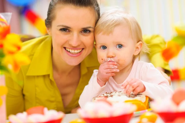 Happy mother and baby on first birthday celebration party — Stock Photo, Image