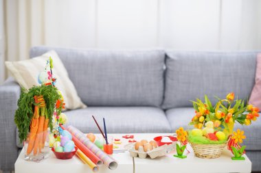 Preparations for Easter. Table with decoration stuff clipart