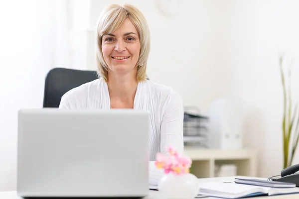 stock image Portrait of happy senior business woman at office