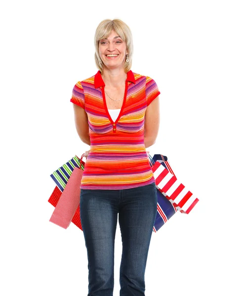 Happy older woman with shopping bags — Stock Photo, Image