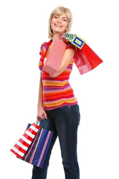 Mulher idosa sorridente com sacos de compras — Fotografia de Stock