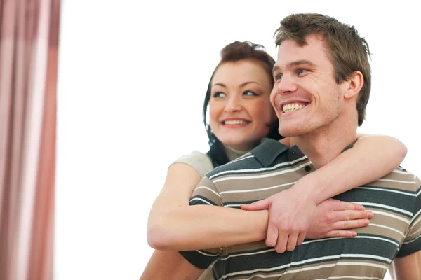 Portrait of smiling young couple looking on copyspace — Stock Photo, Image