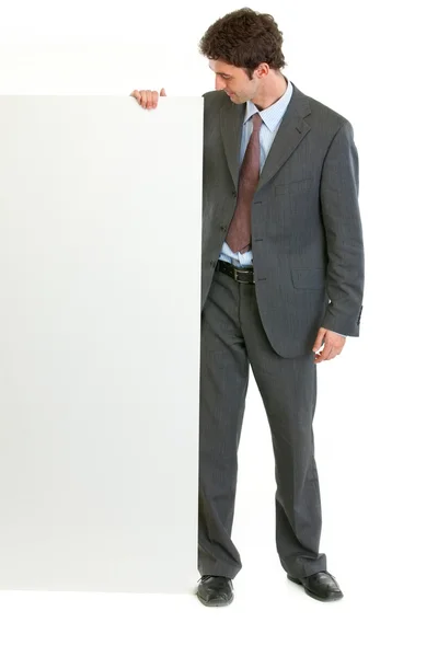 Modern employee looking on blank billboard — Stock Photo, Image