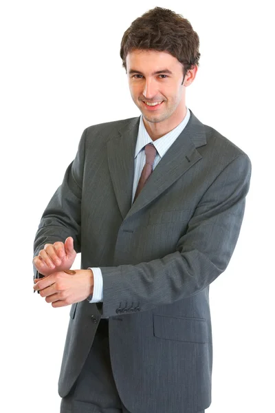 Hombre de negocios moderno mostrando moneda lanzada —  Fotos de Stock