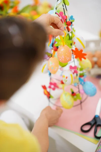 Closeup on female hands making Easter decoration — Stock Photo, Image