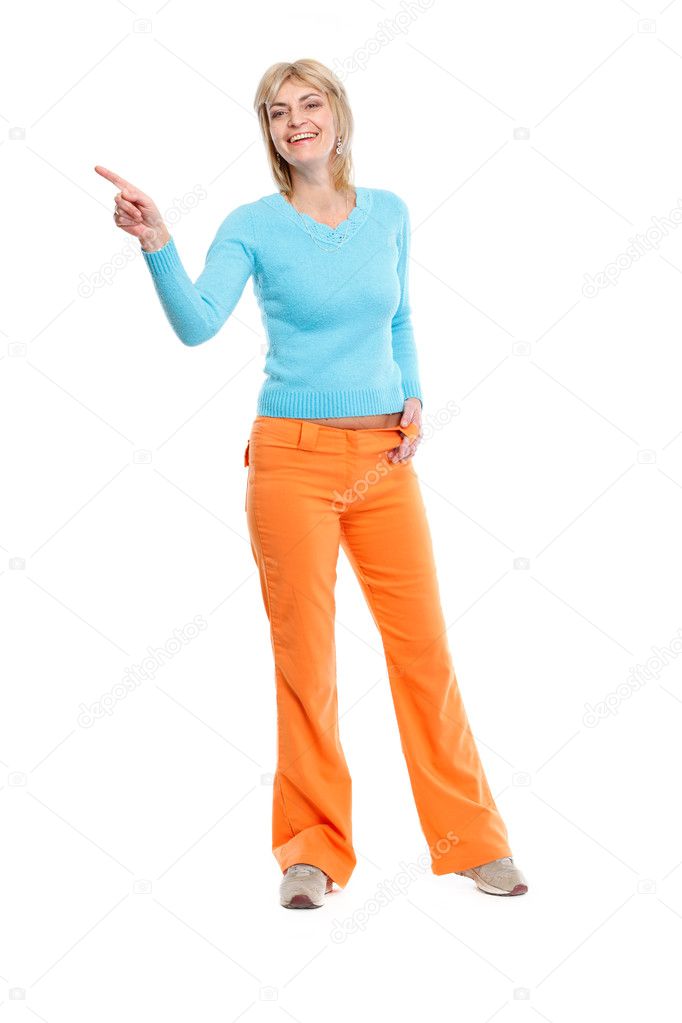 Full length portrait of middle age woman pointing in corner