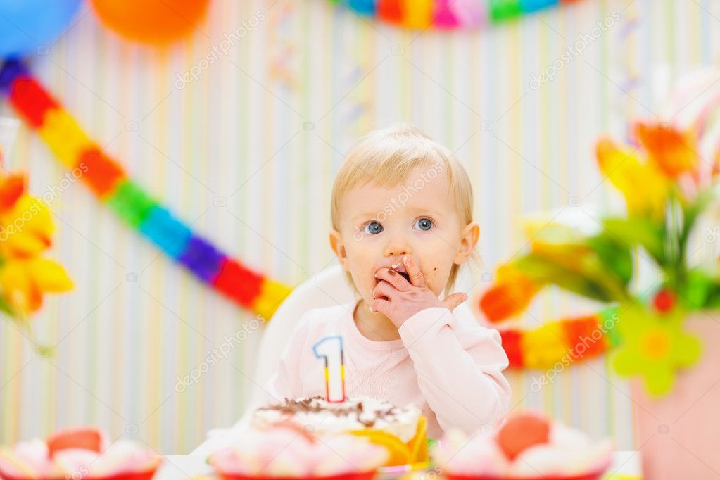 Kid eating first birthday cake — Stock Photo © CITAlliance #9832218