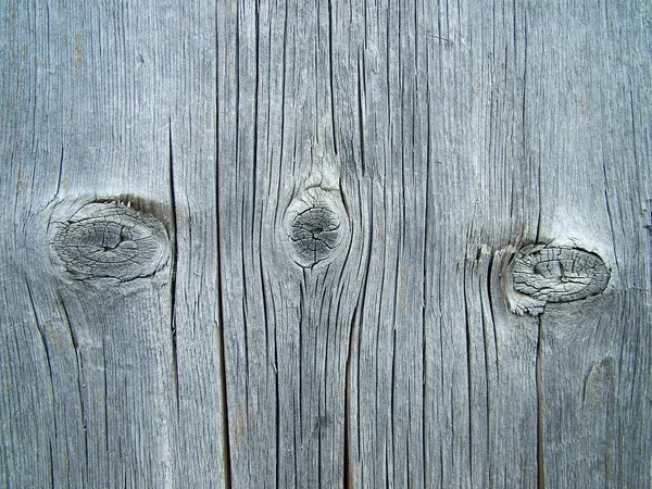 Houten plank textuur met drie knopen — Stockfoto