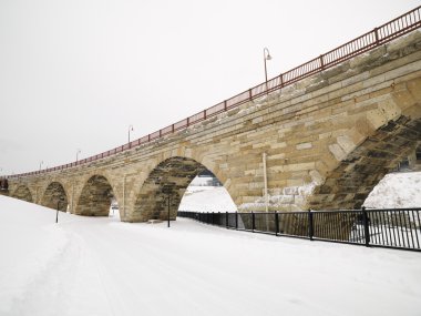 Snowy bridge scene. clipart