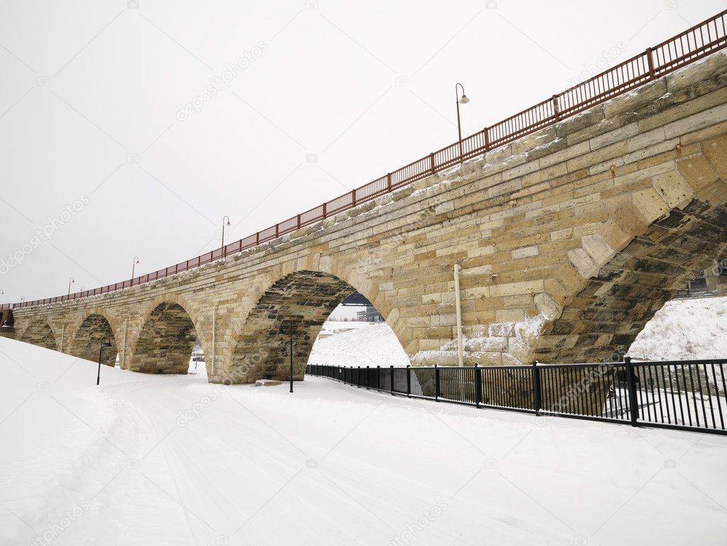 Snowy bridge scene.