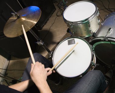 Drummer playing drumset. clipart