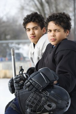 Boys in hockey uniforms. clipart