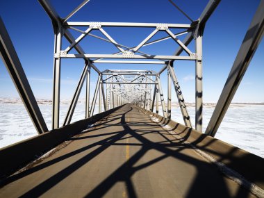 Shadows on bridge. clipart