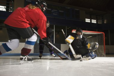 Women playing hockey. clipart