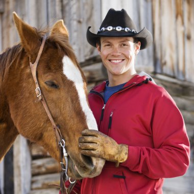 Man petting horse. clipart