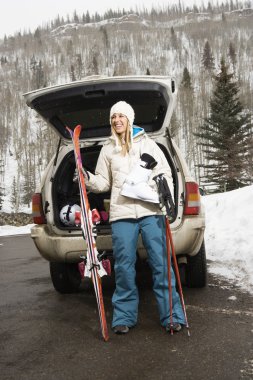 Woman going skiing. clipart