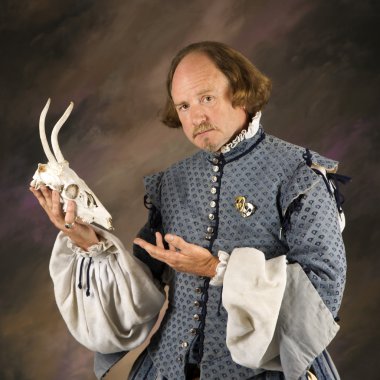 Shakespeare with deer skull. clipart