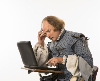 Shakespeare using laptop. clipart