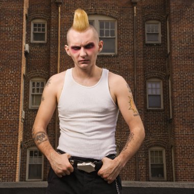 Portrait of a punk outside. clipart