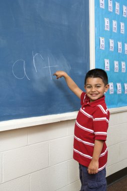 Boy in front of Blackboard clipart