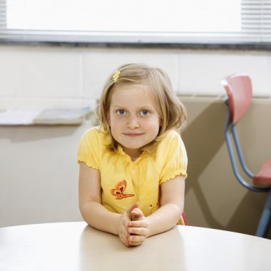 Girl in Classroom. clipart