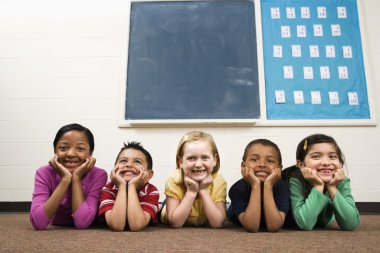 Students Lying on Floor in Classroom. clipart