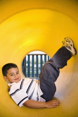 Young Boy Lying in Crawl Tube clipart