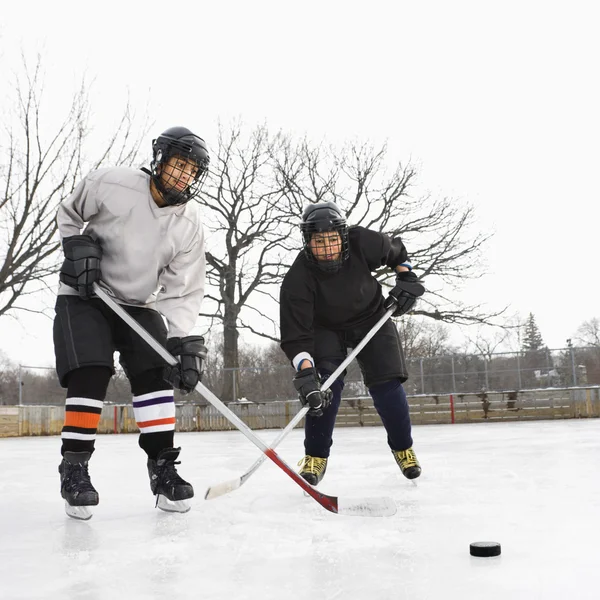 Boys playing ice hockey. — Stok fotoğraf