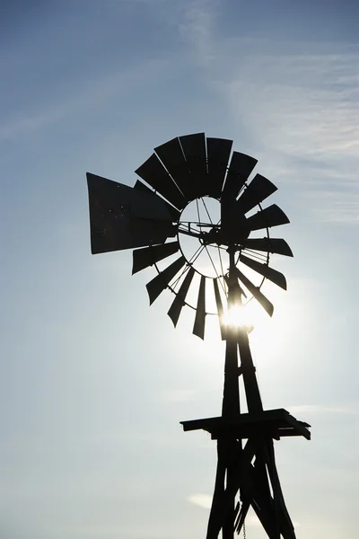 stock image Silhouetted windpump.