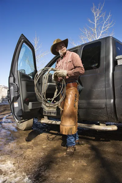 Man Wearing Cowboy Hat With Lariat and Truck — Stock Photo, Image