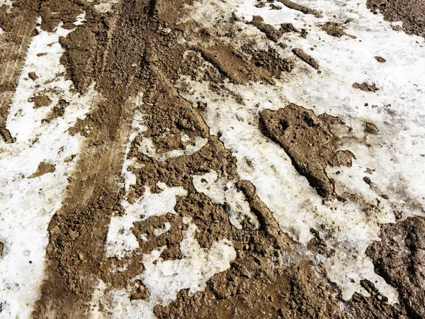 Estrada de terra com neve . — Fotografia de Stock