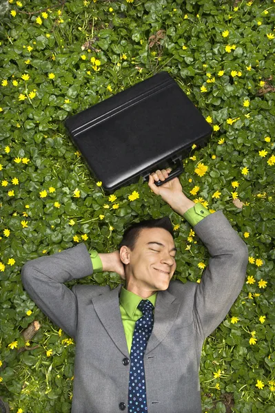 Usmívající se podnikatel v květu patch — Stock fotografie