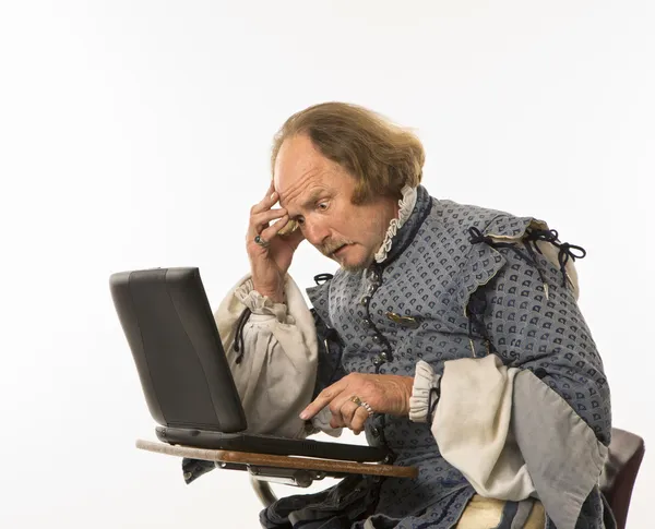 Shakespeare using laptop. — Stock Photo, Image