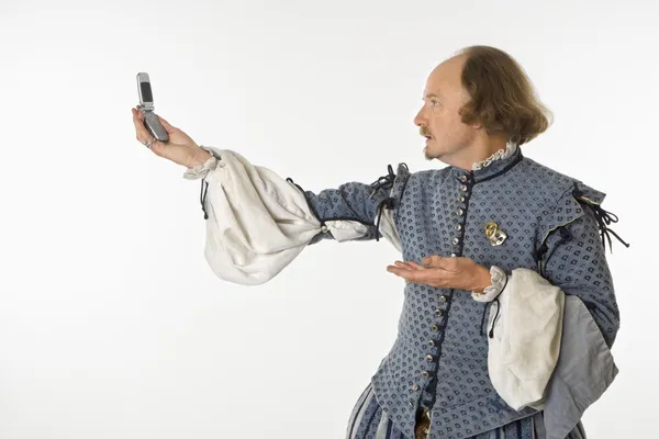 Shakespeare com telefone celular . — Fotografia de Stock
