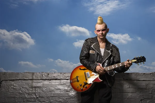 Punk holding guitar. — Stock Photo, Image