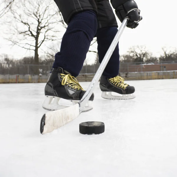 Boy playing ice hockey. Stock Picture
