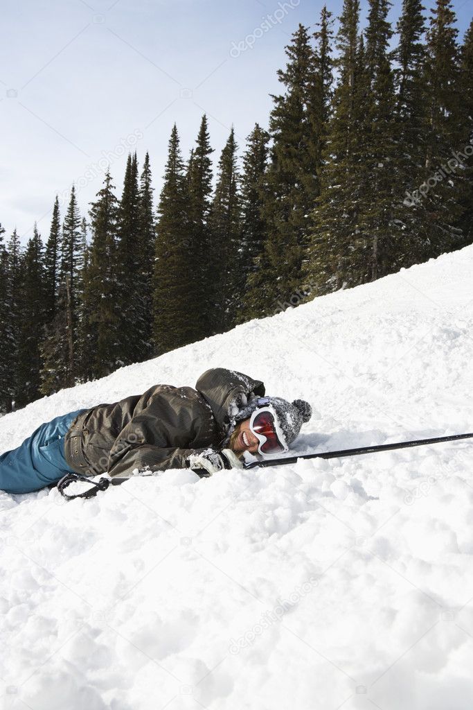 Skier Lying in Snow