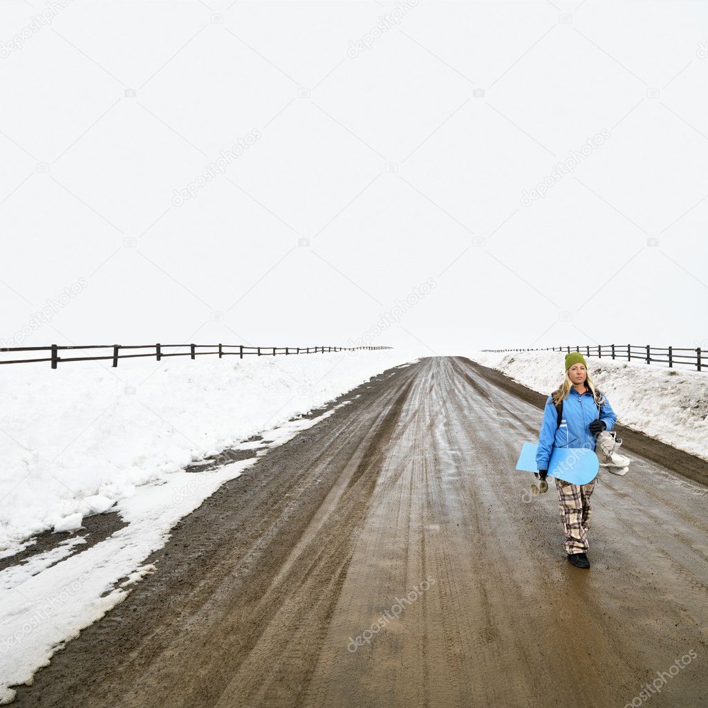 Woman with snowboard.