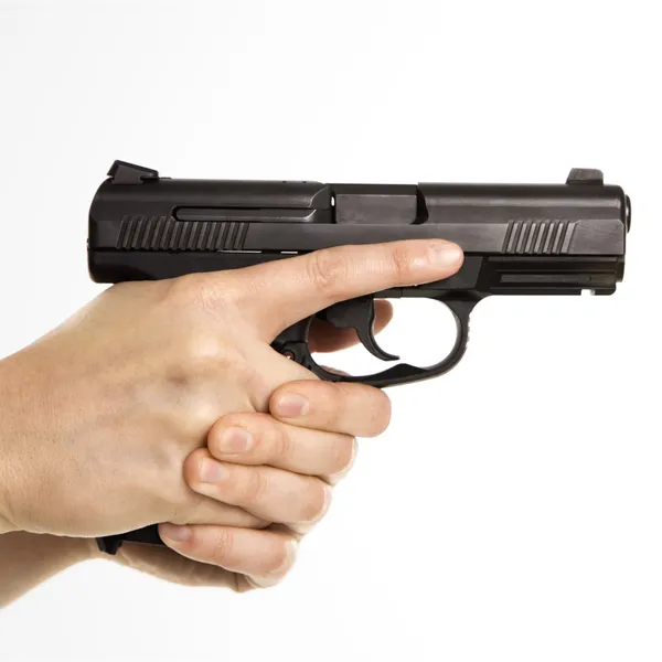 Female holding handgun. — Stock Photo, Image