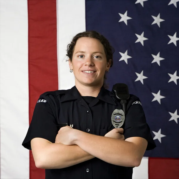 Une policière souriante . — Photo