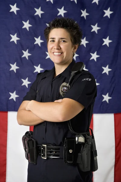 Rendőrnő, zászló. — Stock Fotó