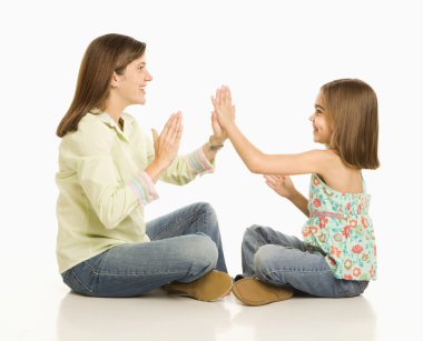 Mother and daughter playing. clipart