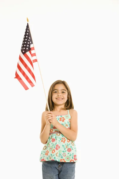 Flicka anläggning amerikanska flaggan. — Stockfoto