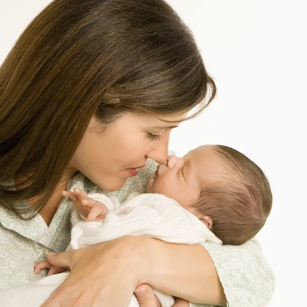 Mother holding baby. Stock Photo